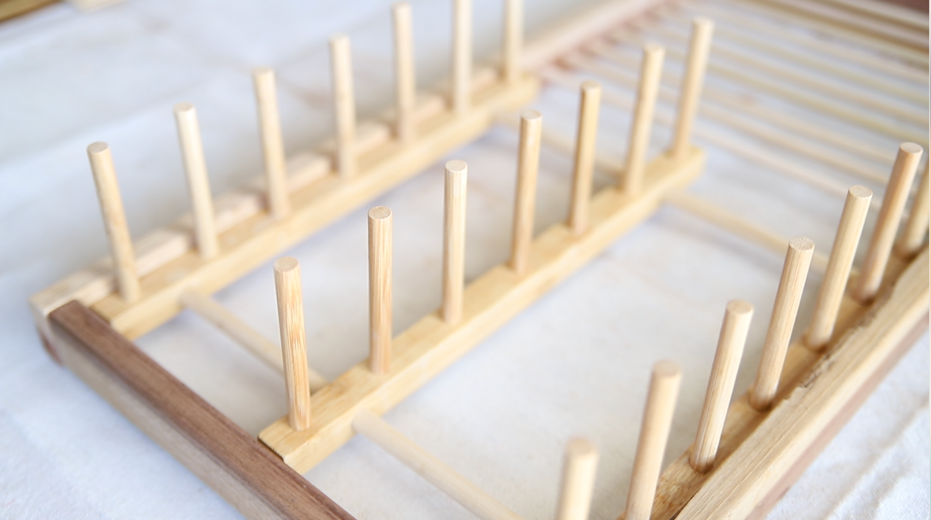 A wooden rack with sticks Description automatically generated with medium confidence